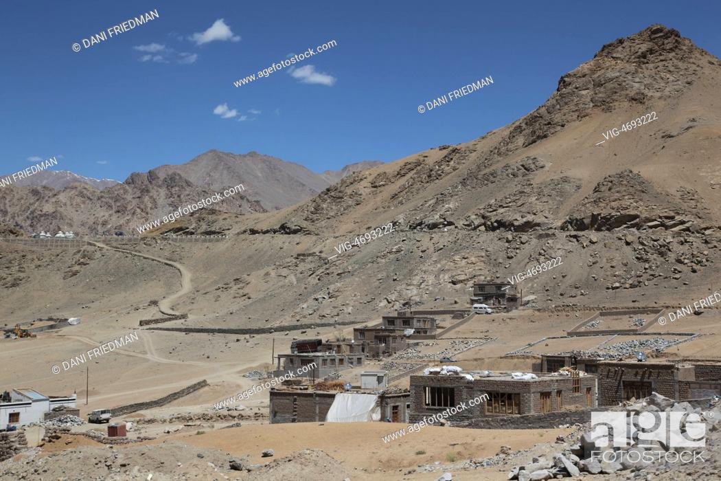 Stock Photo: Newly built homes and homes under construction near Changspa, Leh District, Ladakh, Jammu and Kashmir, India. - CHANGSPA, LADAKH, India, 09/07/2014.