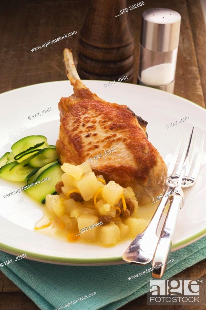 Stock Photo: Pork chop with apple and pear sauce.