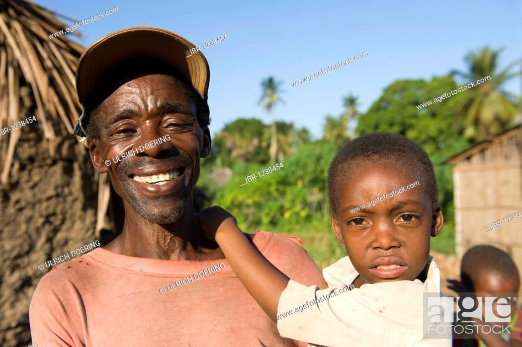 Stock Photo: Father carrying his child, Quelimane, Mozambique, Africa.