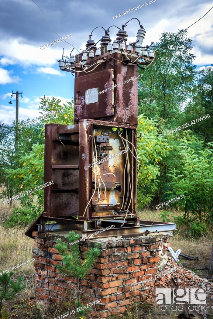 Stock Photo: Rusty electrical box in old kolkhoz near Mashevo village of Chernobyl Nuclear Power Plant Zone of Alienation, Ukraine.