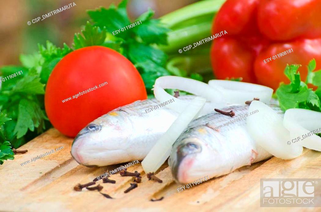 Stock Photo: Mugil cephalus fish with vegetables.