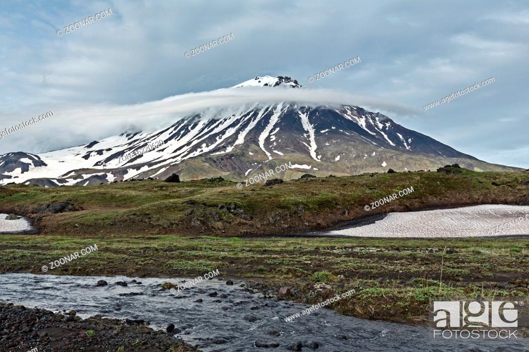 Stock Photo: Kamchatka Peninsula beautiful mountain landscape on cloudy day: view of Oval Zimina Volcano and mountain river. Eurasia, Russian Far East, Kamchatka Region.