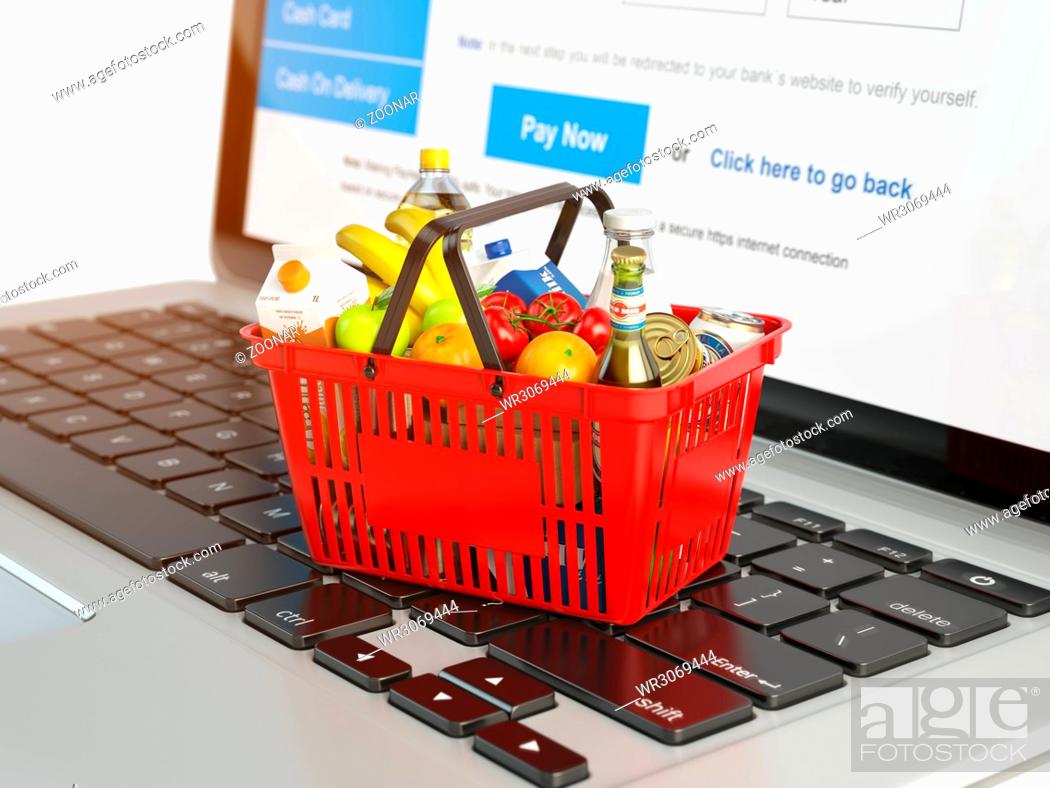 Stock Photo: Shopping basket with variety of grocery products ion laptop keyboard. E-commerce concept.