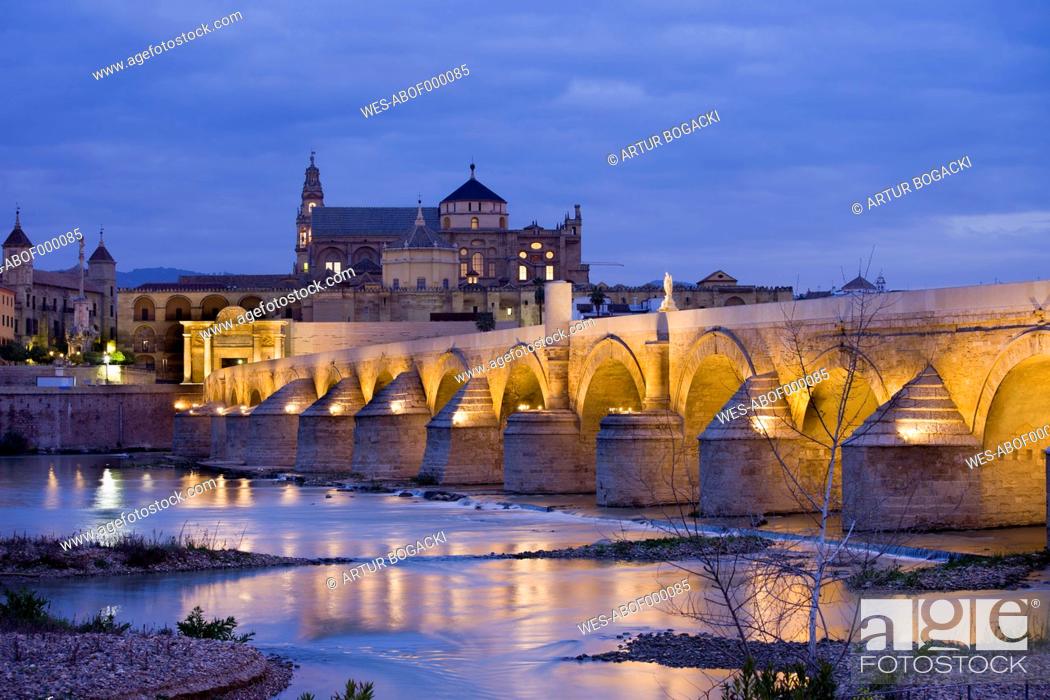 Stock Photo: Spain, Andalusia, Cordoba, Mezquita Mosque Cathedral at dawn, Roman Bridge on Guadalquivir river.