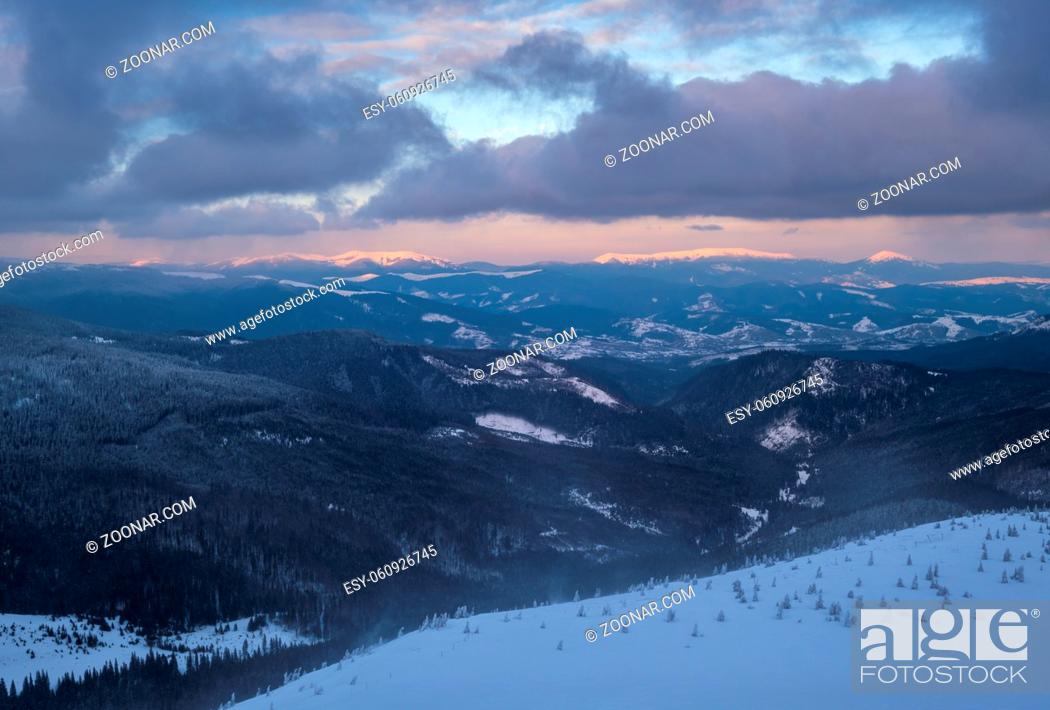 Stock Photo: Picturesque winter alps windy day sunrise. Panoramic mountains view from Svydovets ridge and Dragobrat ski resort.