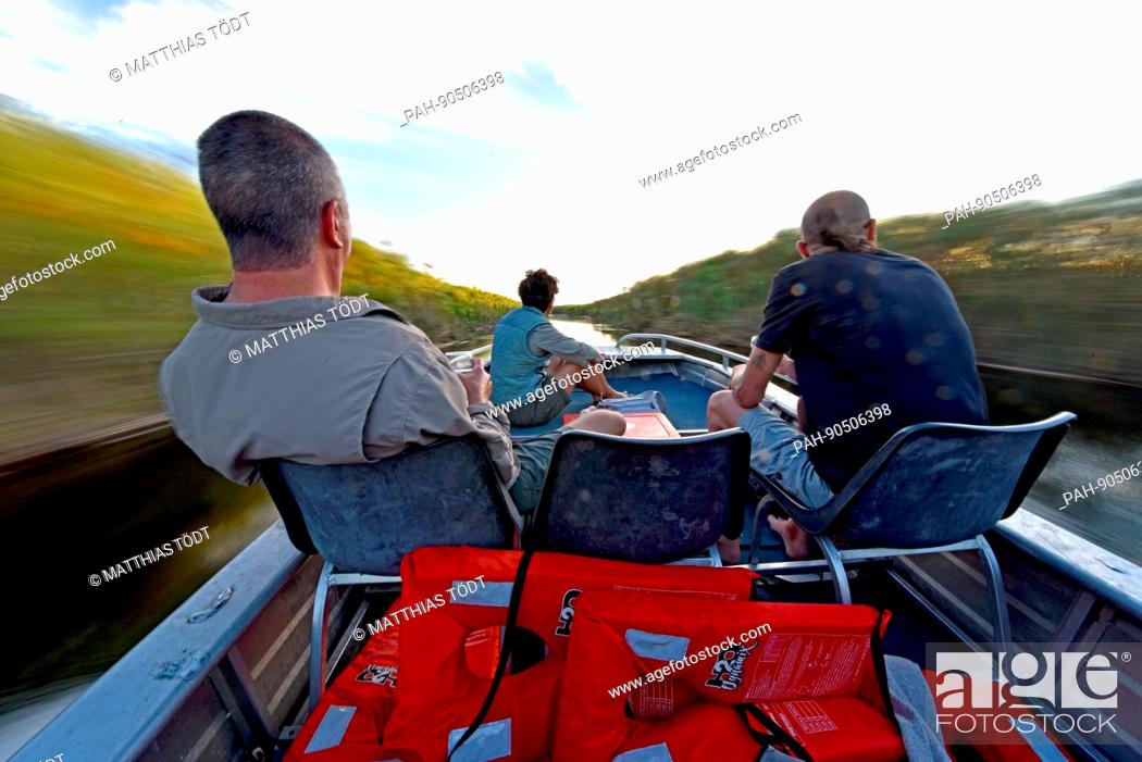 Stock Photo: Speedboat trip on the Okavango river and part of the Okavango delta. Taken on 08.04.2017. Tourists can hire boats like this and be driven along on the river and.