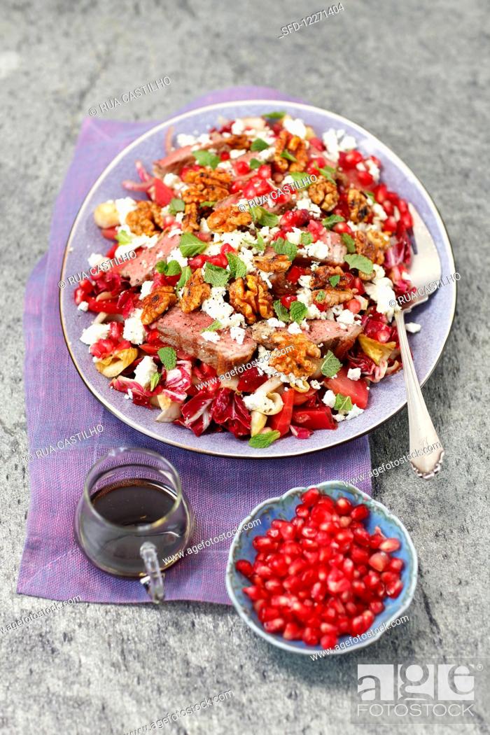 Stock Photo: Radicchio salad with beets, roastbeef, pomegranate, feta and caramelized walnuts.