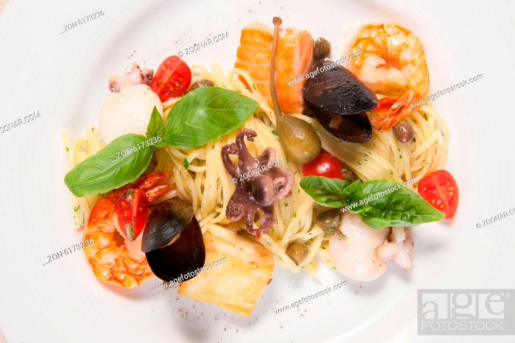 Stock Photo: White dish with pasta and sea food.