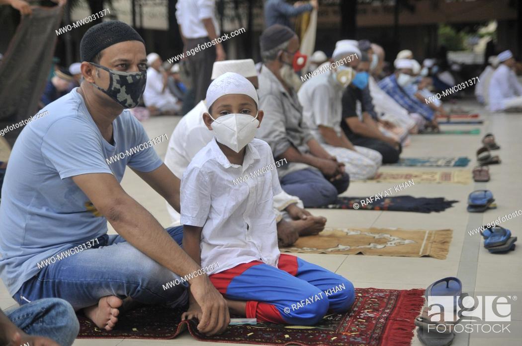 Stock Photo: Muslims attending Friday prayers during the coronavirus pandemic at Hazrat Shahjalal Dorgarh Mosque, while maintaining social distancing and other health.
