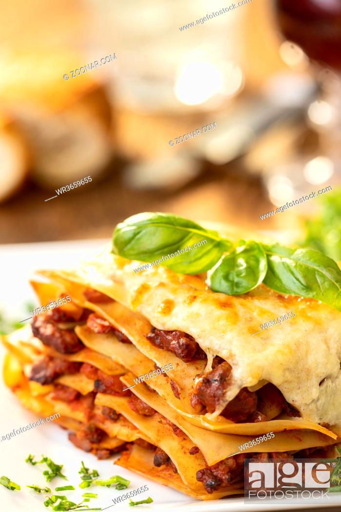 Stock Photo: closeup of a portion of lasagna.