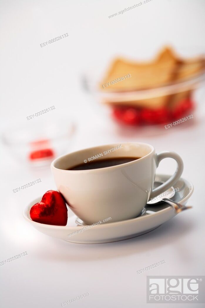 Stock Photo: White cup with coffee and one chocolate.