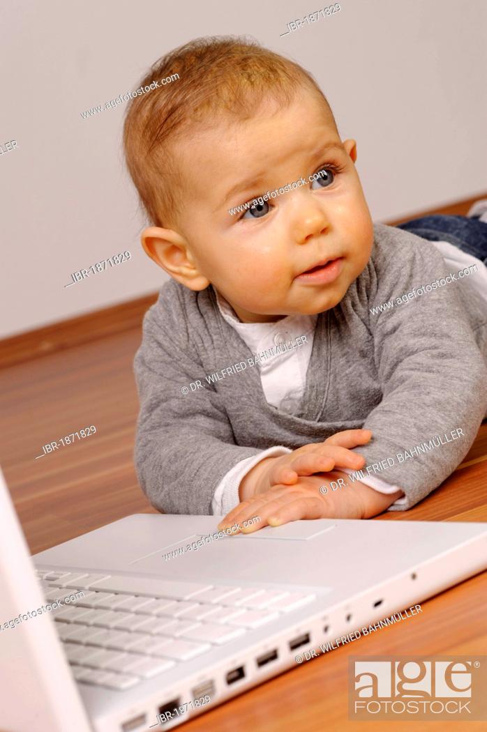 Stock Photo: 6-month-old infant with laptop.
