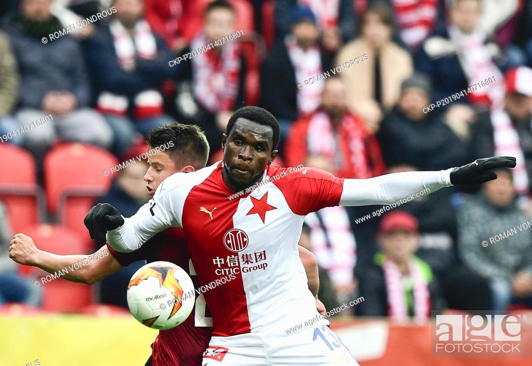Stock Photo: R-L Michael Ngadeu-Ngadjui (Slavia) and Adam Hlozek (Sparta) in action during the Czech first soccer league (Fortuna Liga), 28th round.