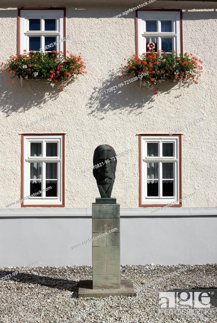 Stock Photo: A bust of Friedrich Froebel in front of his birth house in Obeweissbach, Germany, 19 August 2017. The house is now a museum.