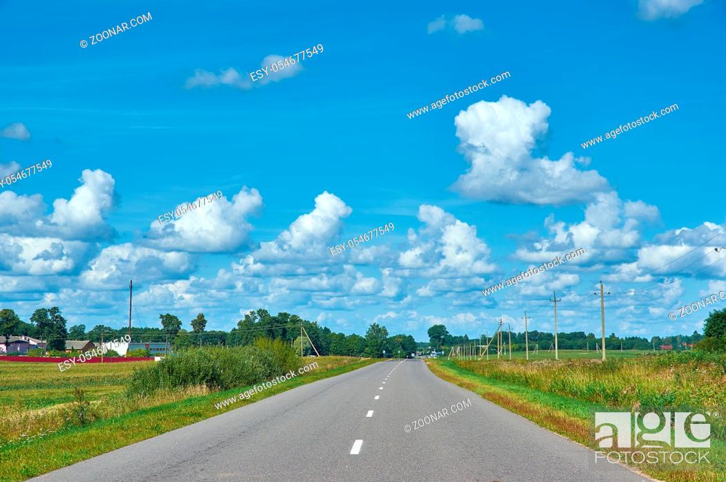 Photo de stock: Belarusian Country road in the field. Myadzyel district.