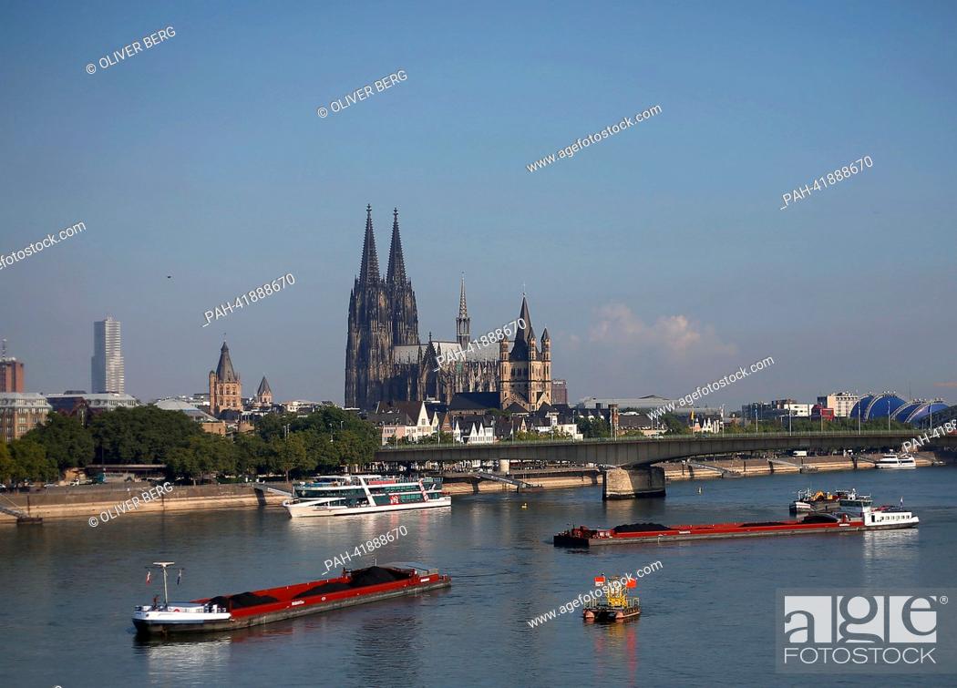 Stock Photo: Two parts of a combination of a push boat and barges have run aground in the Rhine in Cologne, Germany, 20 August 2013. After several ships ran aground.