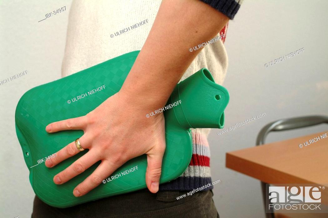 Stock Photo: Backache with hot-water bottle.