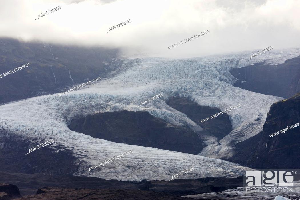 Stock Photo: Svinafellsjökull is a glacier tongue from Vatnajökull. It has retreated by several kilometers due to climate change and the warmer weather.