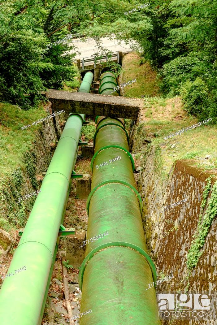 Stock Photo: detail of water pipelines in woods servicing an hydroelectric production plant, shot near Verres, valley Aosta, Italy.
