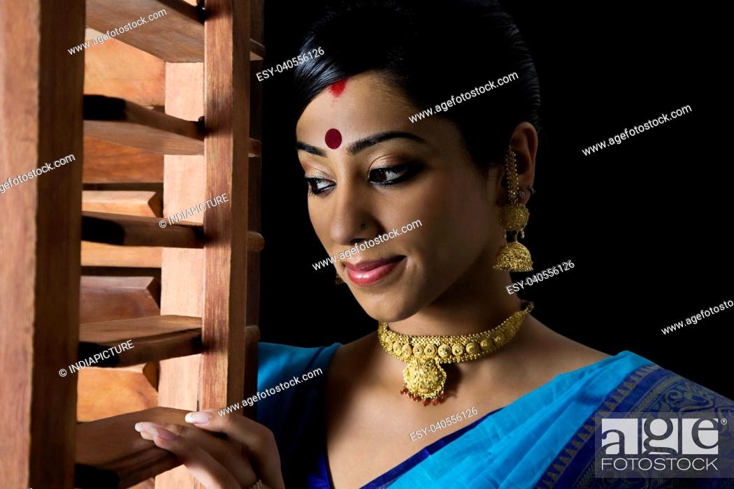 Bengali woman peeking out of a window, Stock Photo, Picture And Low Budget  Royalty Free Image. Pic. ESY-040556126 | agefotostock