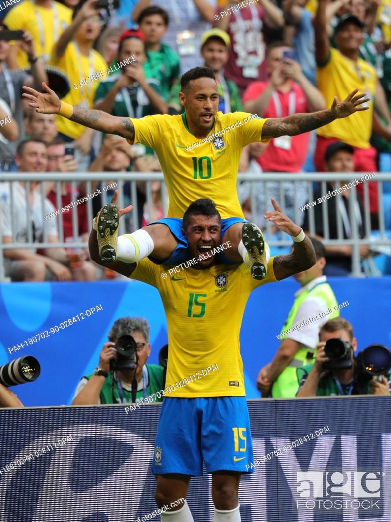 Stock Photo: 02 July 2018, Russia, Samara: Soccer, World Cup 2018, Final round - round of 16: Mexico vs. Brazil at the Samara stadium: Brazil's Neymar (top) celebrating his.
