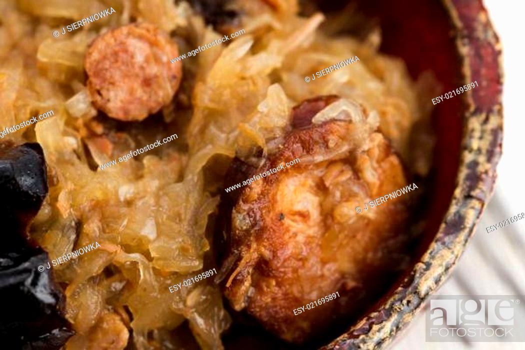 Stock Photo: traditional polish sauerkraut (bigos) with mushrooms and plums.