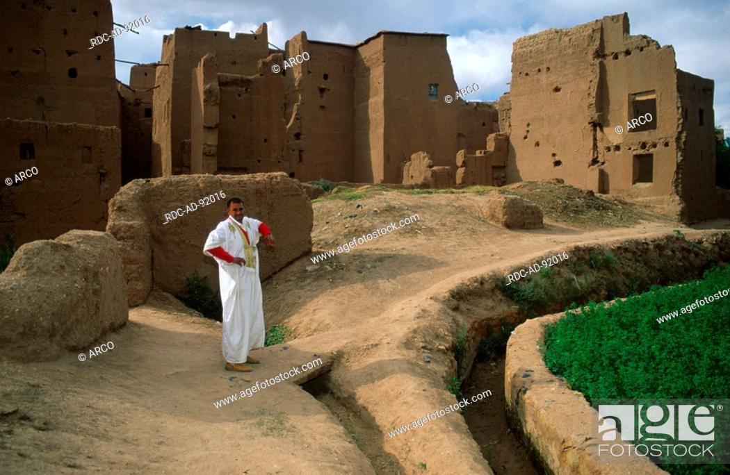 Stock Photo: Man in traditional clothes at ruins, Tinerhir, High Atlas, Morocco.