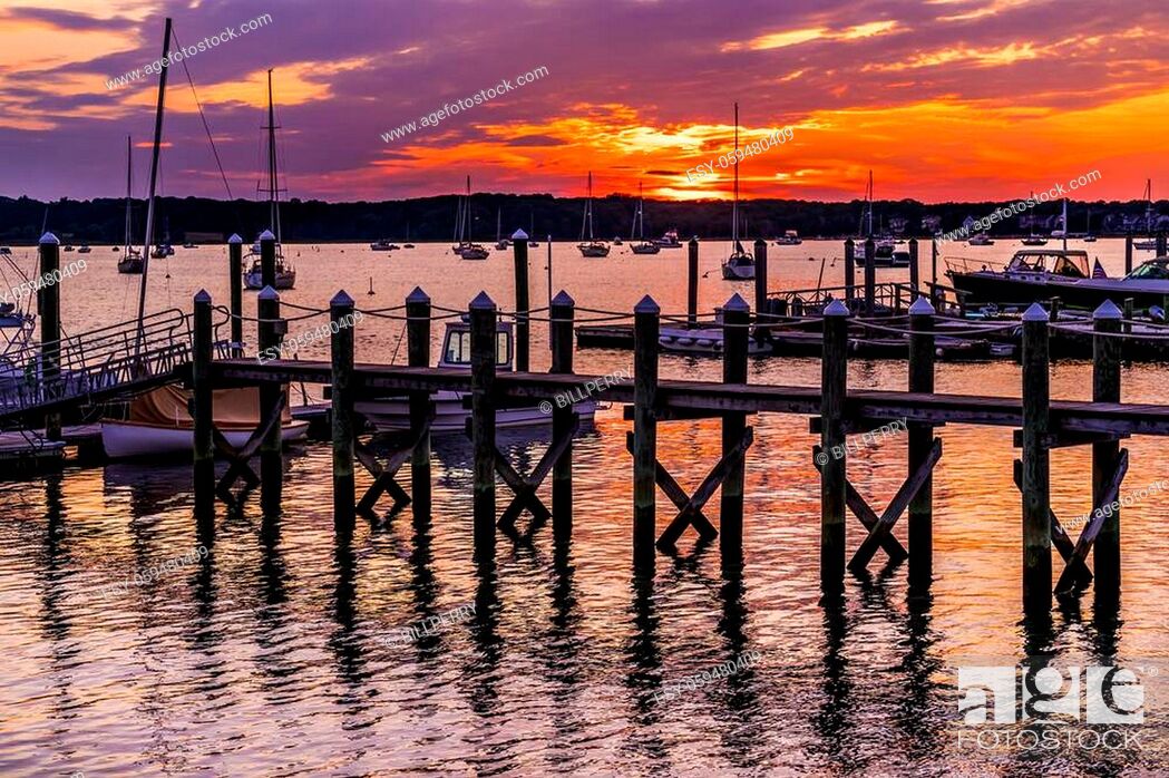Stock Photo: Sunset Pier Padanaram Inner Harbor Motorboats Sailboats Dartmouth Massachusetts.