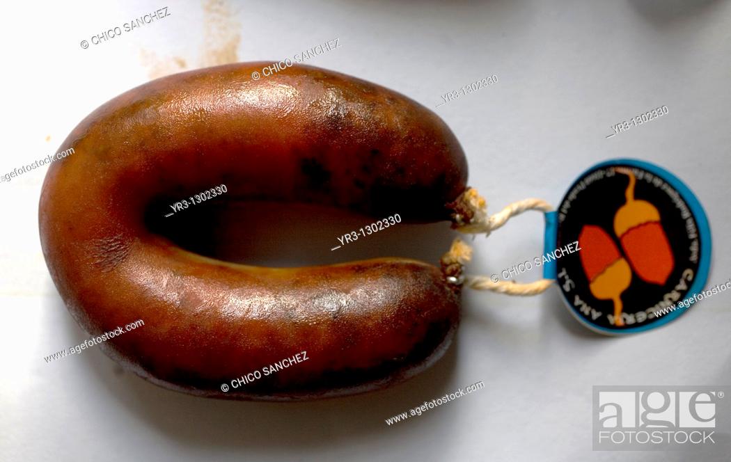 Stock Photo: A sausage, or chorizo, made from Spanish Iberian pigs, the source of Iberico ham known as Pata Negra, in a meat shop in Prado del Rey, Sierra de Cadiz.