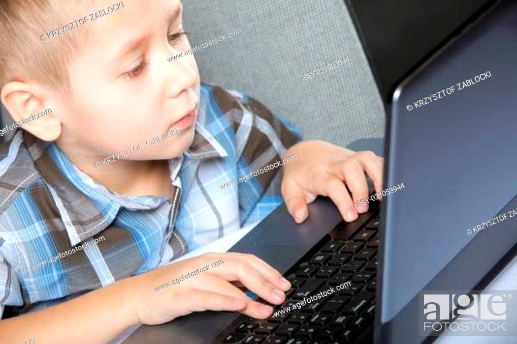 Stock Photo: Computer addiction child with laptop notebook.
