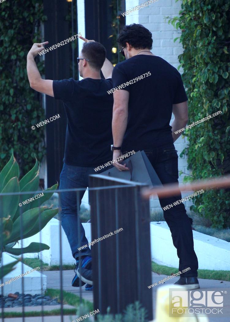 Stock Photo: Joe Manganiello seen leaving John Varvatos in Los Angeles. As the actor exits a man is seen walking in front of him, showing hand signals and shouting.
