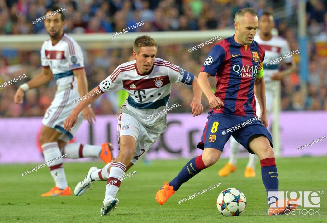 Stock Photo: Barcelona's Andres Iniesta (R) and Munich's Philipp Lahm (C) vie for the ball during the UEFA Champions League semi-final first leg soccer match betweeen.