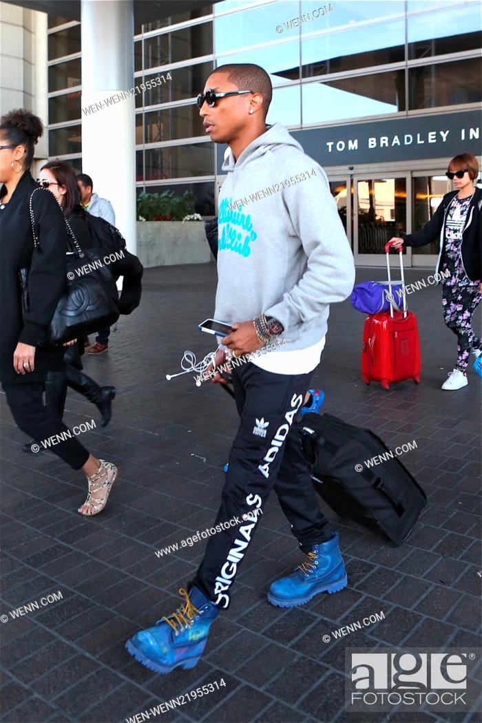 Celda de poder radio Necesitar Pharrell Williams arrives a Los Angeles International Airport (LAX)  Featuring: Pharrell Williams..., Foto de Stock, Imagen Derechos Protegidos  Pic. WEN-WENN21955314 | agefotostock