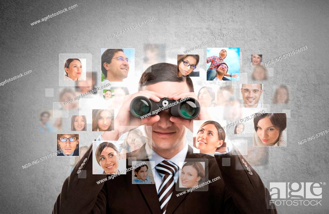 Stock Photo: Human resources, CRM, assessment center and social media concept - business man looking for employees through binoculars.