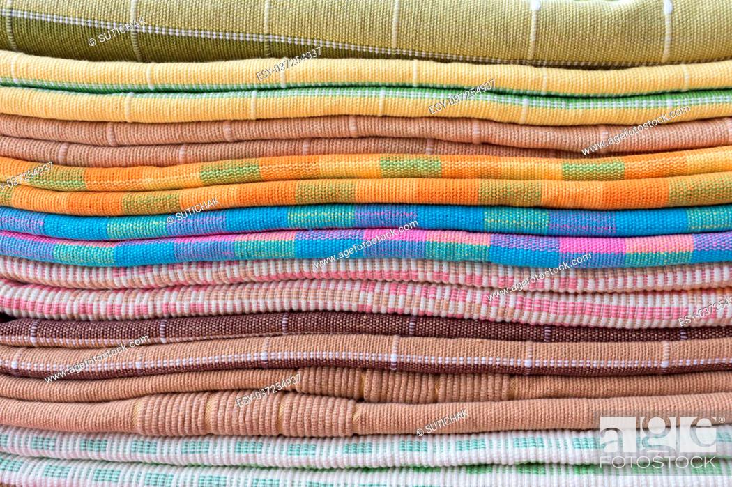 Stock Photo: heap of cloth fabric in retail shop.