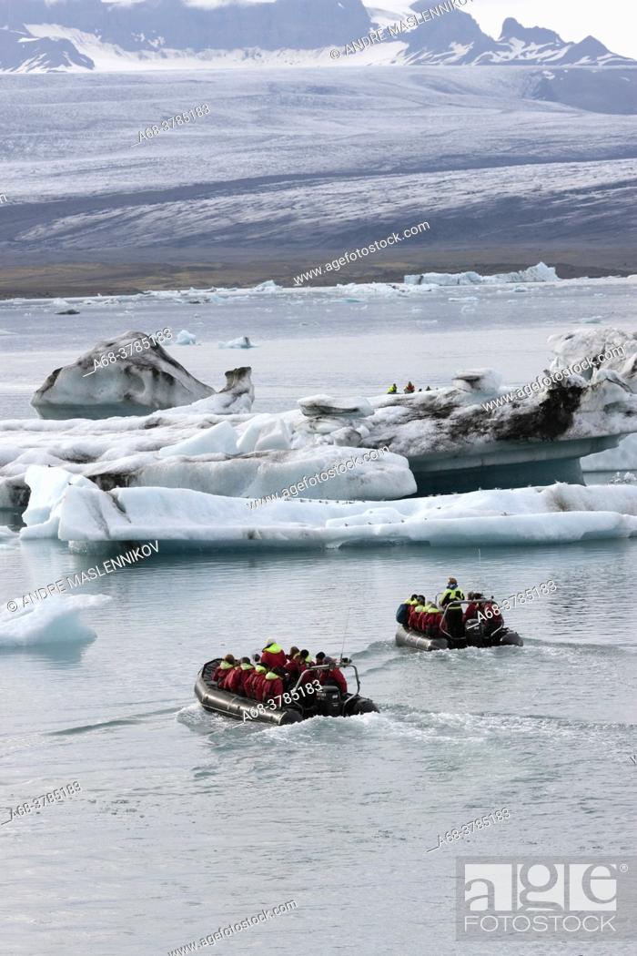 Stock Photo: Boat trip on Jökulsarlon which is a calving bay from Vatnjökull. It has retreated by several kilometers due to climate change and the warmer weather.