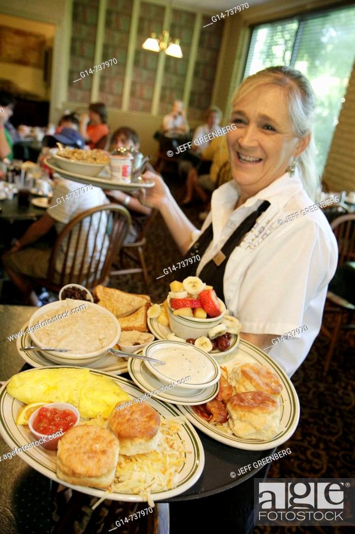 Stock Photo: Arkansas, Eureka Springs, Best Western Inn of the Ozarks, Myrtie Mae's Restaurant, woman, waitress, food, plate, breakfast, egg, biscuit, service, dining out,.