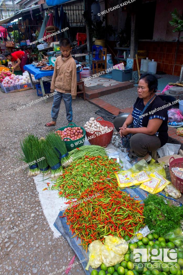 Stock Photo: Chili peppers for sale on the early morning market in the UNESCO world heritage town of Luang Prabang in Central Laos.