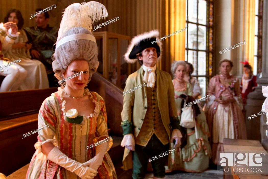 Stock Photo: Nobles in the Royal chapel, courtship party (Fete galante) with participants wearing clothes from the Louis XIV period, Palace of Versailles, France.