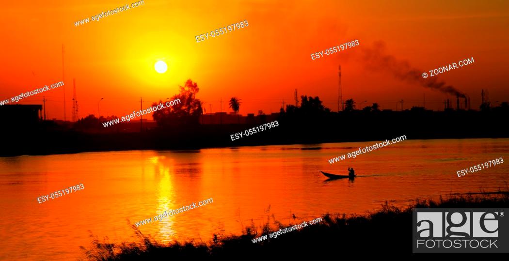 Stock Photo: Landscapeof Euphrates river in Nasiriyah city at the sunset, Iraq.
