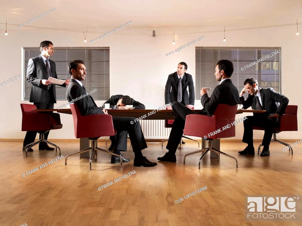 Stock Photo: Business man at boardroom table. Photo montage with same person in different positions, sleeping, listening, drinking coffee.