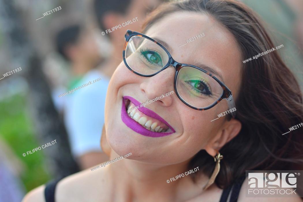 Photo de stock: Caucasian girl with glasses smiles close up portrait.
