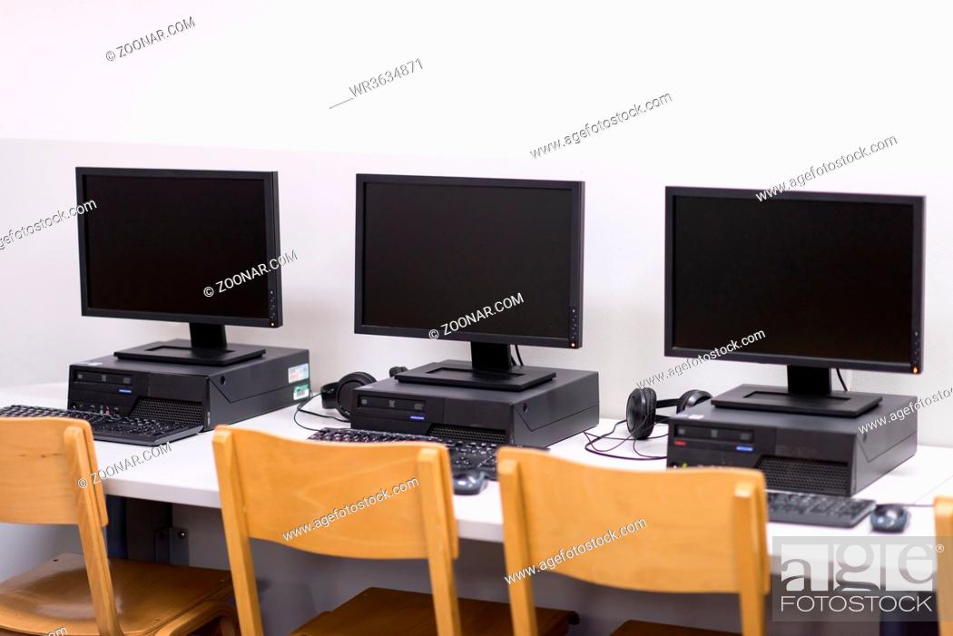 Stock Photo: Computer Lab, Neatly placed rows of computer.