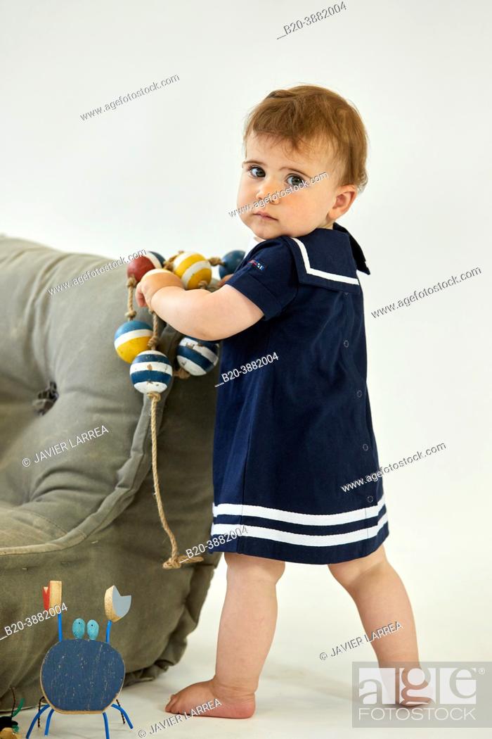 Stock Photo: Girl 1-2 years, Baby, Sailor accessories, Studio photography.
