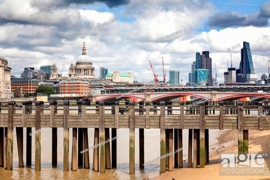 Stock Photo: Wharf on the River Thames, with Blackfriars Bridge, St Paul' Cathedral and the City of London beyond.