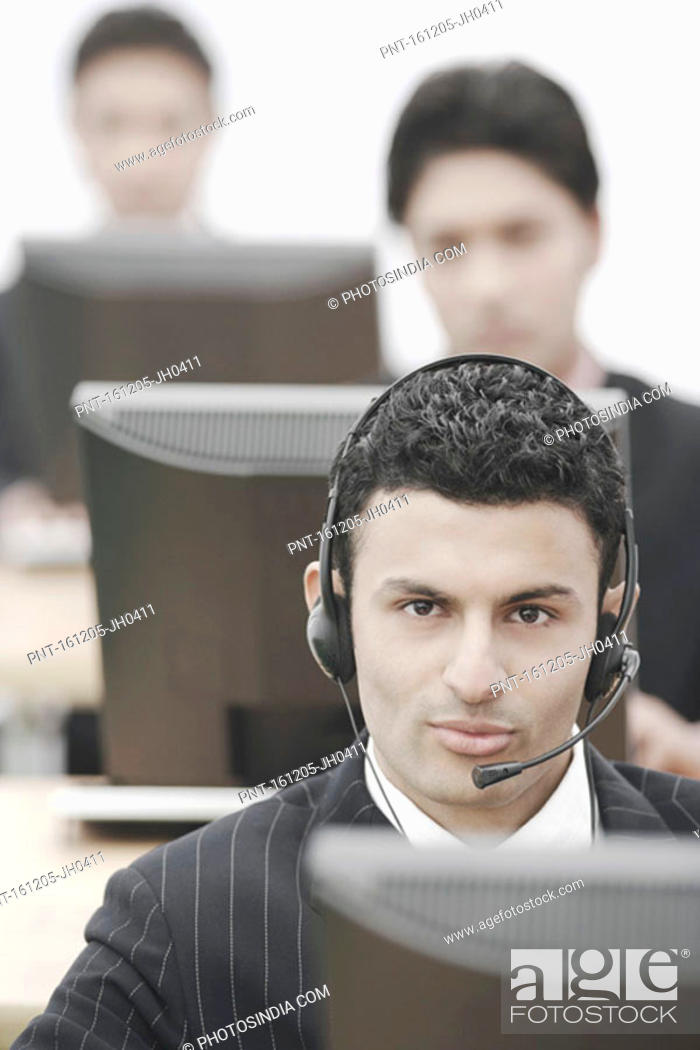Stock Photo: Portrait of a businessman wearing a headset.