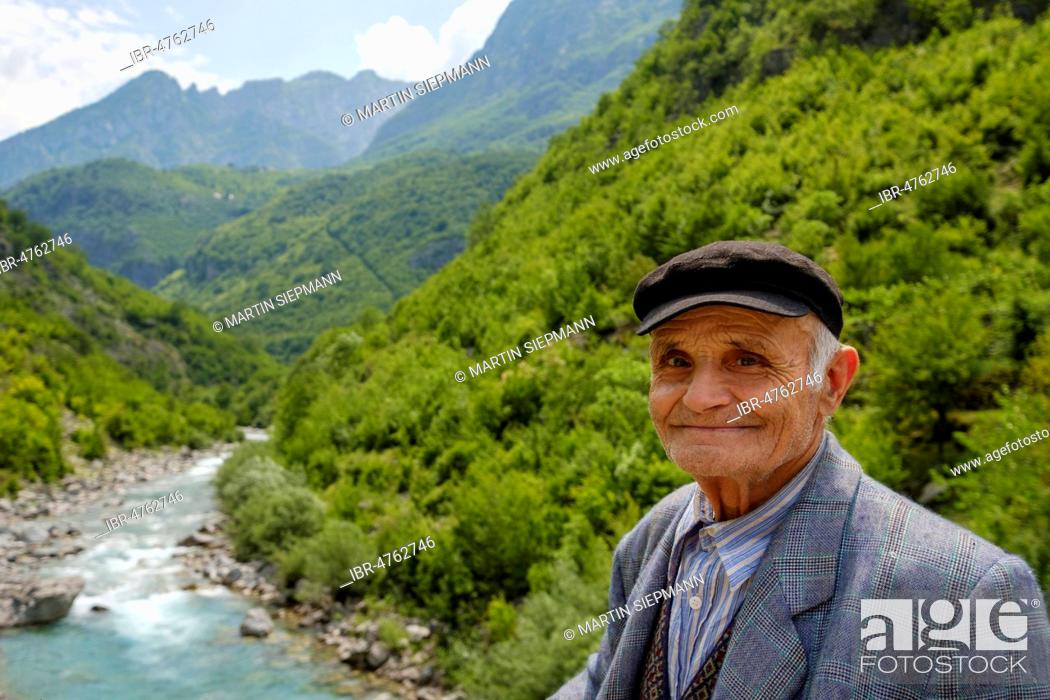 Stock Photo: Old man in front of river Cem i Vuklit, Tamara, Tamarë, region Kelmend, Albanian Alps, Prokletije, Qark Shkodra, Albania.