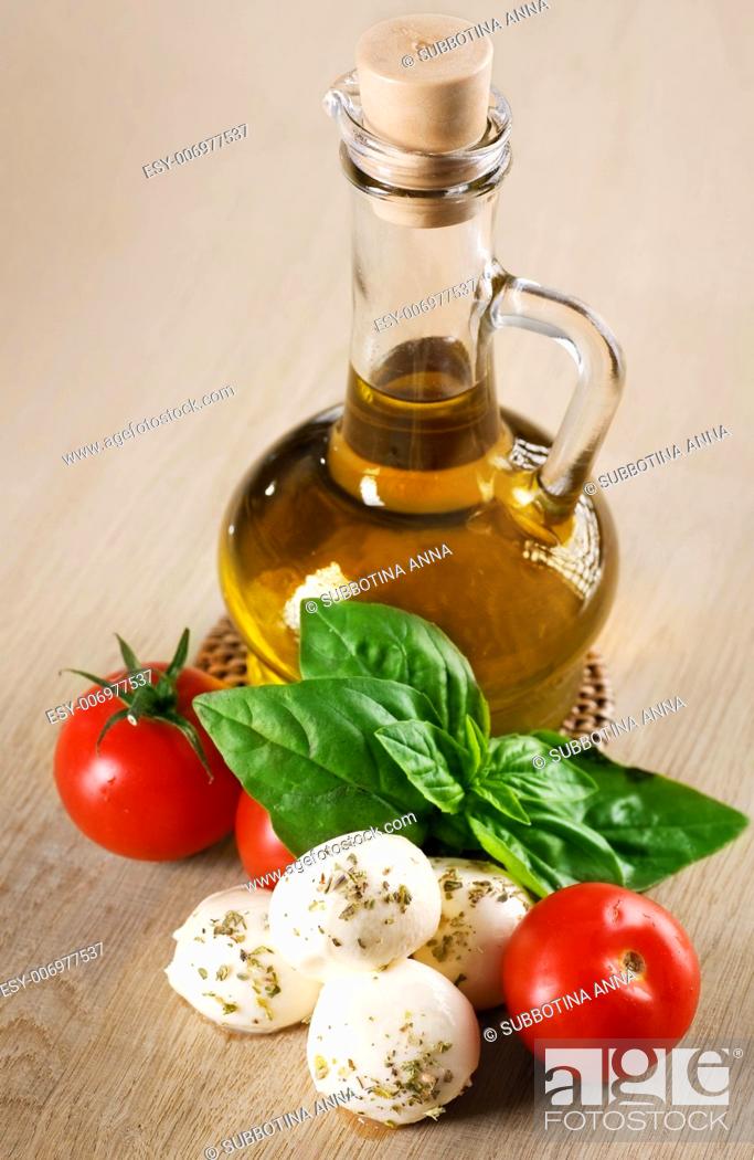 Stock Photo: Olive Oil With Mozzarella, Tomato And Fresh Basil.