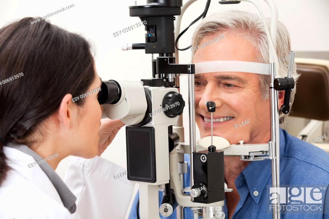 Stock Photo: Optometrist performing visual field test.