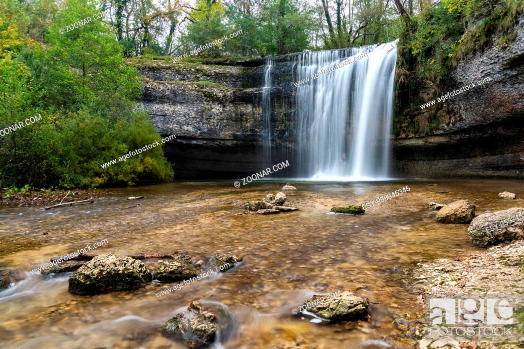 Stock Photo: A beautiful autumn forest landscape with idyllic waterfall and pool.